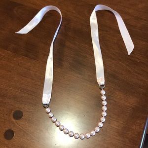 Pink pearl necklace with satin bow tie